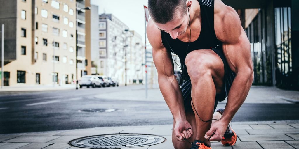 man tying his shoes